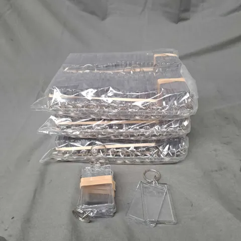 APPROXIMATELY 50 CLEAR PLASTIC PHOTO KEYRINGS