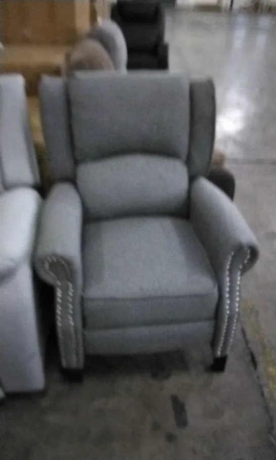 DESIGNER GREY FABRIC RECLINING ARMCHAIR WITH STUDDED DETAIL