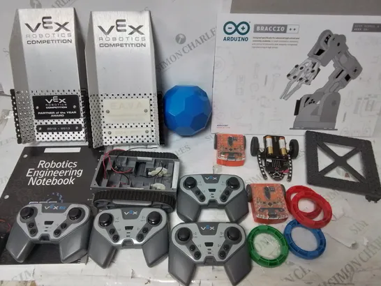 LOT OF ASSORTED ITEMS TO INCLUDE ASSORTED EDUCATIONAL ROBOTICS ITEMS, VEX PLASTIC BACKGROUNDS, ADJUSTABLE TRAY STAND, STORAGE BLOCKS AND SILICONE SEALANT