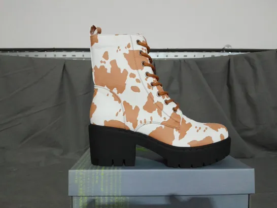 BOXED PAIR OF KOI COW PRINT BOOTS SIZE 6