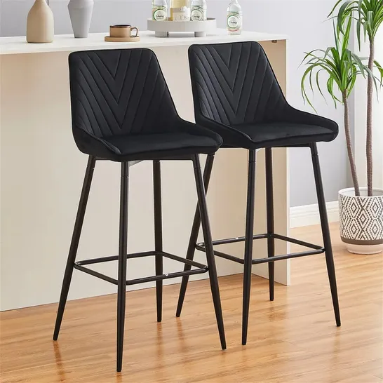 A BOXED PAIR IF BLACK VELVET UPHOLSTERED BAR STOOLS