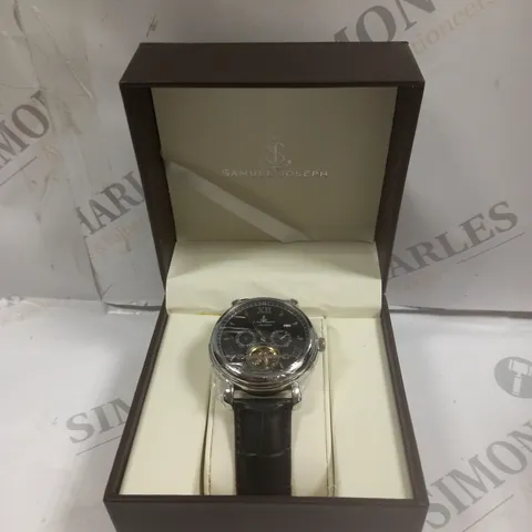 BOXED SAMUEL JOSEPH AUTOMATIC STEEL BLACK WATCH WITH LEATHER STRAP