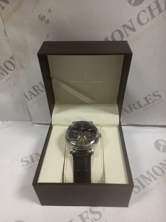 BOXED SAMUEL JOSEPH AUTOMATIC STEEL BLACK WATCH WITH LEATHER STRAP