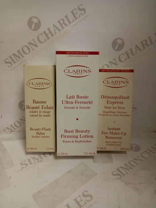 LOT OF 3 ASSORTED CLARINS PRODUCTS TO INCLUDE BEAUTY FLASH BALM 50ML, BUST BEAUTY FIRMING LOTION 200ML, EYE MAKUP REMOVER 200ML