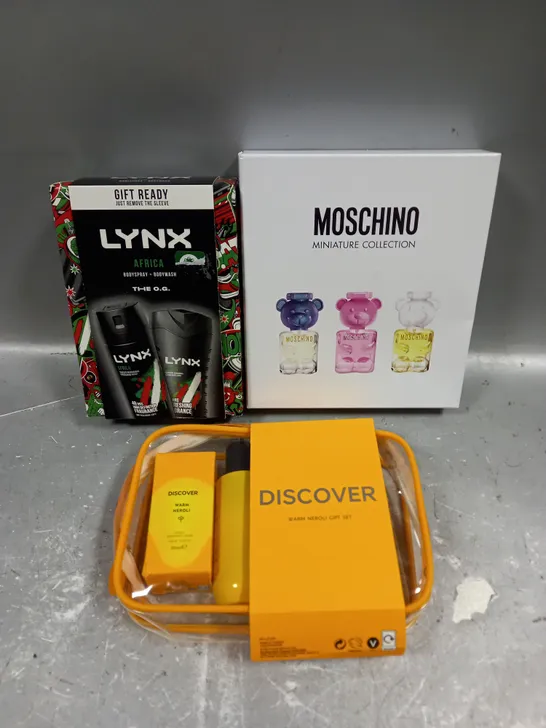 LOT OF 3 ASSORTED COSMETIC BOXSETS TO INCLUDE - LYNX AFRICA BODY COLLECTION - MOSCHINO MINIATURE COLLECTION - DISCOVER WARM NEROLI GIFT SET