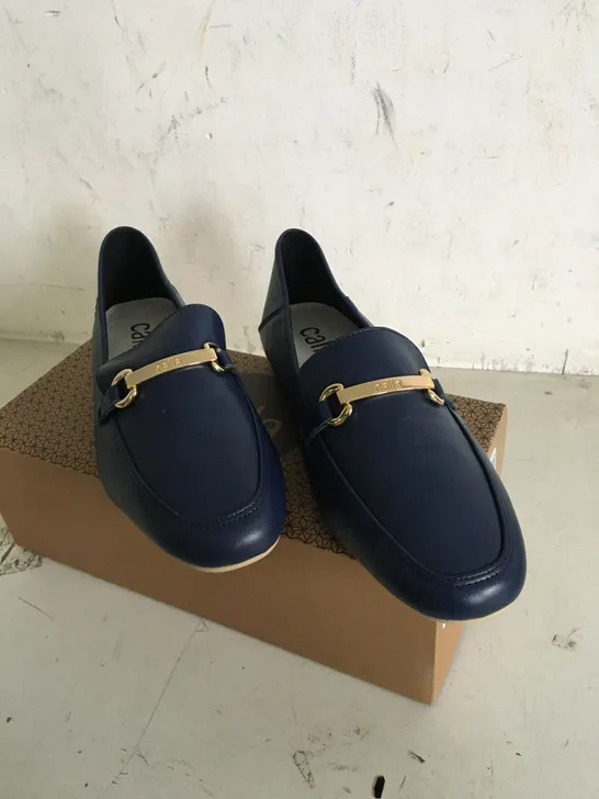 BOXED PAIR OF SIZE 38.5 CALLA NAVY SHOES