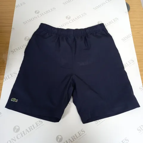 LACOSTE SPORTS SHORTS IN NAVY - SIZE 16