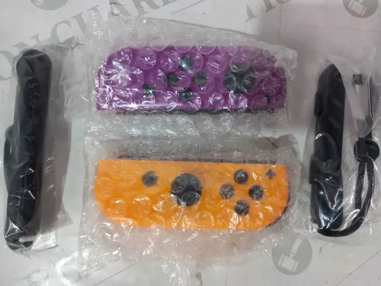 NINTENDO SWITCH SET OF CONTROLLERS IN PURPLE AND ORANGE