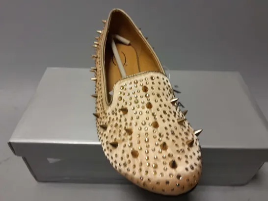 APPROXIMATELY 13 CASANDRA SPIKED SLIPONS IN CHAMPAGNE SATIN IN VARIOUS SIZES