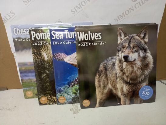 LOT OF 10 ASSORTED 2022 CALENDERS TO INCLUDE SEA TURTLES, WOLVES, POMERANIANS, ETC