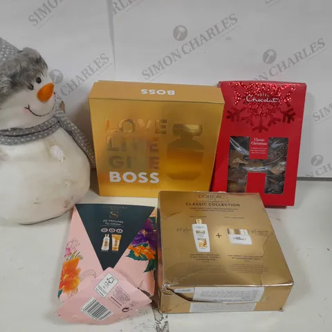 APPROXIMATELY 25 ASSORTED PRODUCTS TO INCLUDE; SNOWMAN PLUSH, LARGE GIN GLASS, MILK TO CARAMEL SLEEKSTERS, PAMPER NIGHT, BOSS THE SCENT FOR HER 50ML, 25 MINUTES TO GLOW, RUDOLPH THE RED NOSED REINDEER