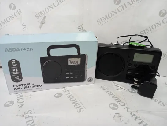 BOXED PORTABLE AM/FM RADIO IN BLACK