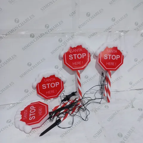 FESTIVE SET OF 4 PRE-LIT SANTA STOP HERE 58CM STAKES