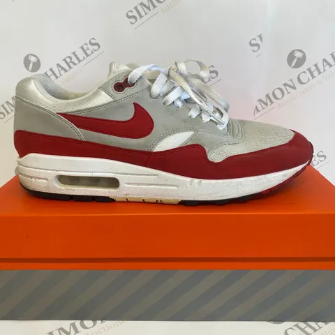 BOXED PAIR OF NIKE RED/GREY SIZE 9 TRAINERS 
