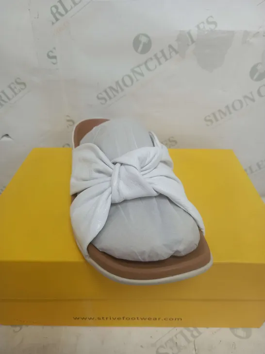 BOXED PAIR OF STRIVE SICILY ALIDER SANDALS IN WHITE SIZE 9