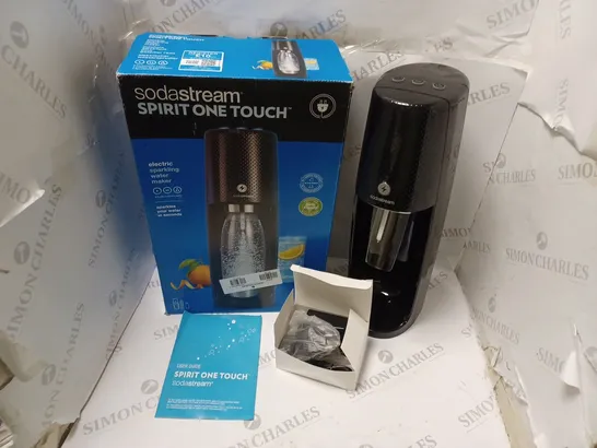 BOXED SODASTREAM SPIRIT ONE TOUCH ELECTRIC SPARKLING WATER MAKER, WITH POWER SUPPLY AND USER GUIDE