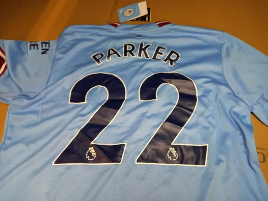 Manchester city home top parker on the back