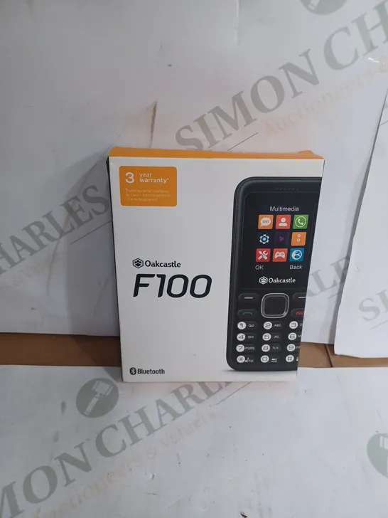 OAKCASLTE F100 TOUCHPAD MOBILE PHONE