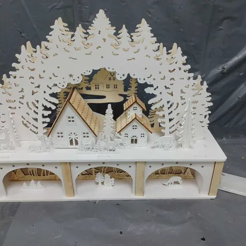 WHITE WOOD LIT VILLAGE SCENE