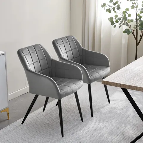 A BOXED PAIR OF GREY VELVET UPHOLSTERED DINING ROOM CHAIRS 