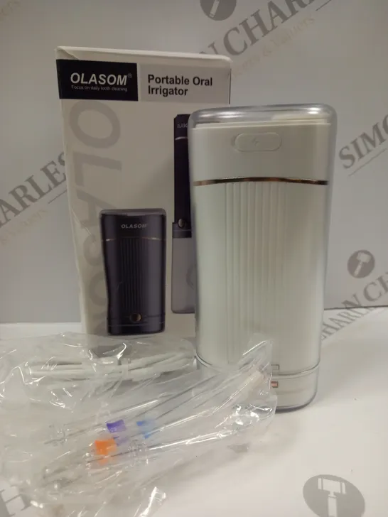 BOXED OLASOM PORTABLE ORAL IRRIGATOR 