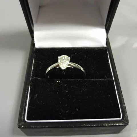 18CT GOLD SOLITAIRE RING SET WITH A NATURAL PEAR CUT DIAMOND WEIGHING