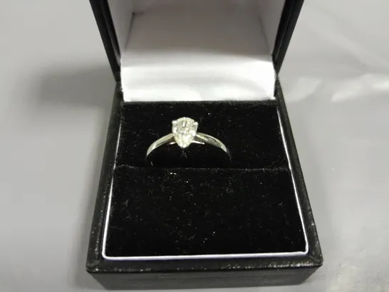 18CT GOLD SOLITAIRE RING SET WITH A NATURAL PEAR CUT DIAMOND WEIGHING