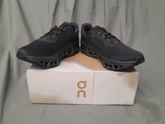 BOXED PAIR OF ON RUNNING CLOUDMONSTER TRAINERS IN BLACK UK SIZE 9