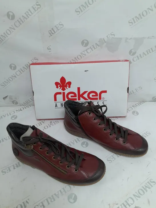 BOXED PAIR OF RIEKER SIDE ZIP WATER RESISTANT BOOTS IN BURGUNDY SIZE 8