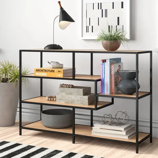 A BOXED ROMILDA 78CM H X 114CM W STEEL GEOMETRIC BOOKCASE 