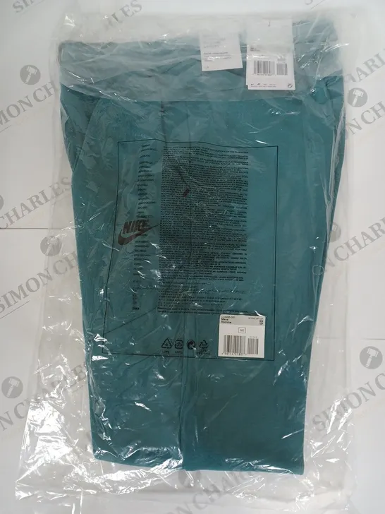 NIKE SLIM FIT TAPERED PANTS IN TEAL SIZE XS