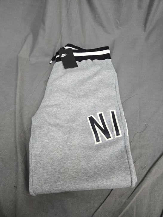 NIKE FLEECED TRACKSUIT BOTTOMS SIZE L