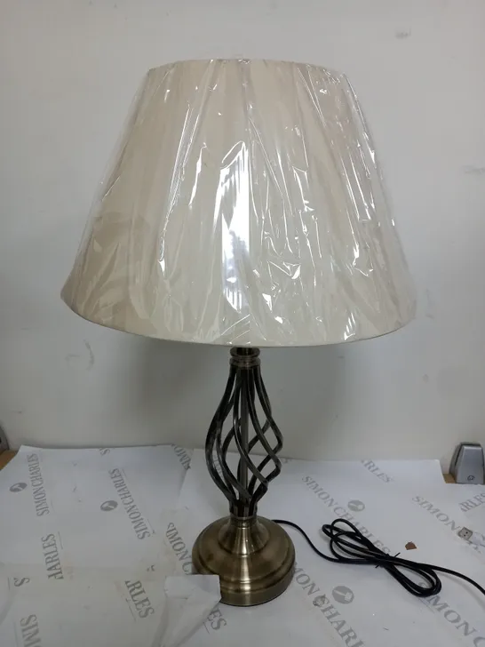 TWISTED TABLE LAMP IN ANTIQUE BRASS COLOUR