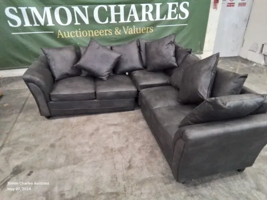 DESIGNER LEATHER LOOK FABRIC UPHOLSTERED CORNER SOFA IN BLACK HEAVILY DAMAGED AT REAR OF FRAME