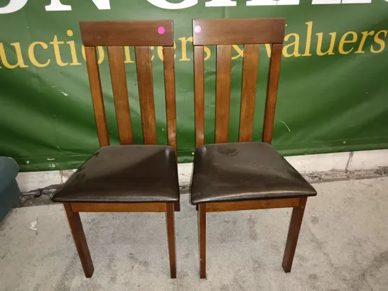 PAIR OF WOODEN DINING CHAIRS WITH BLACK FAUX LEATHER SEAT PADS 