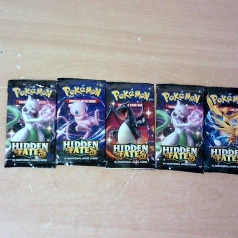 LOT OF APPROXIMATELY 5 UNOPENED PACKS OF POKEMON CARDS