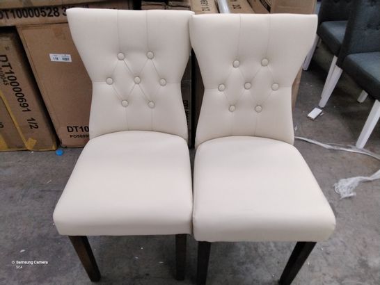 2 DESIGNER CREAM/ WHITE FAUX LEATHER CHAIRS WITH BUTTONED BACKS ON WOODEN LEGS 