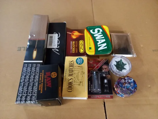 LOT OF ASSORTED SMOKING ACCESSORIES TO INCLUDE RAW GRINDER AND MATCHES