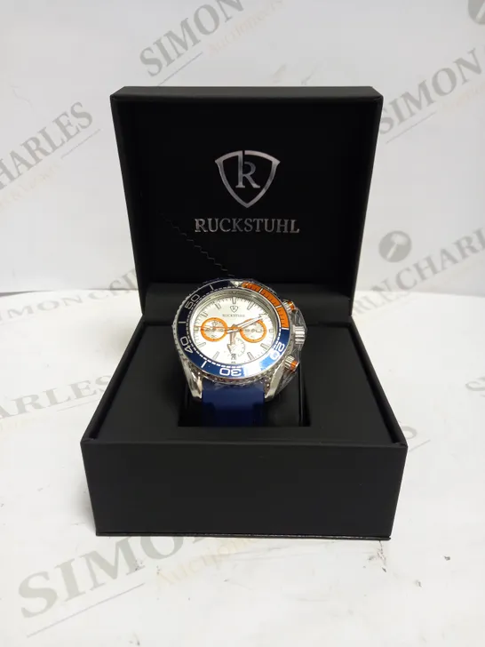 MEN’S RUCKSTUHL CHRONOGRAPH R400 WATCH – SILVER COLOUR CASE – SILVER DIAL – 3ATM WATER RESISTANT – BLUE RUBBER STRAP 