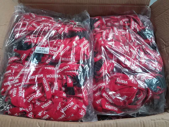 LOT OF APPROXIMATELY 900 RED VISITOR BRANDED LANYARDS