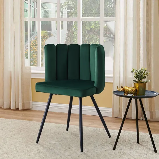 A BOXED GREEN VELVET CURVED BACK CHAIR