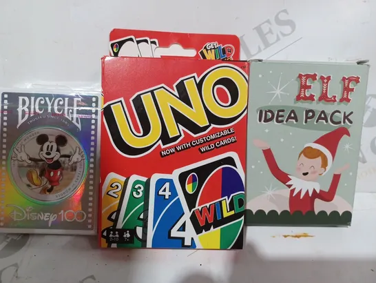 BOX OF APPROXIMATELY 10 ASSORTED TOYS AND GAMES TO INCLUDE ELF IDEA PACK, UNO, BICYCLE DISNEY100 PLAYING CARDS, ETC