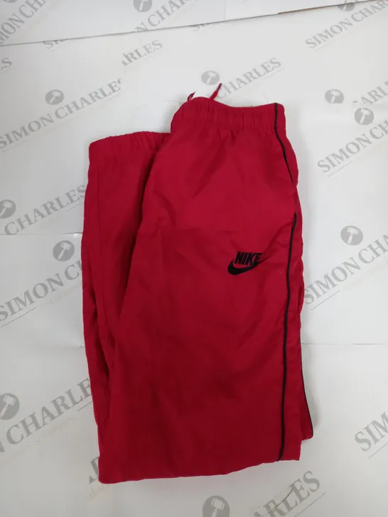 NIKE LOGO TRACKSUIT BOTTOMS IN RED SIZE 7