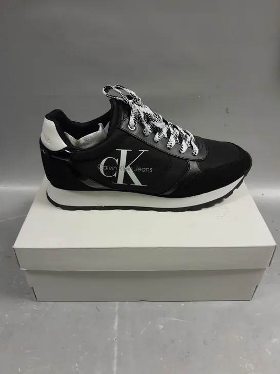 BOXED PAIR OF CALVIN KLEIN CAYLE BLACK FABRIC TRAINERS - 8