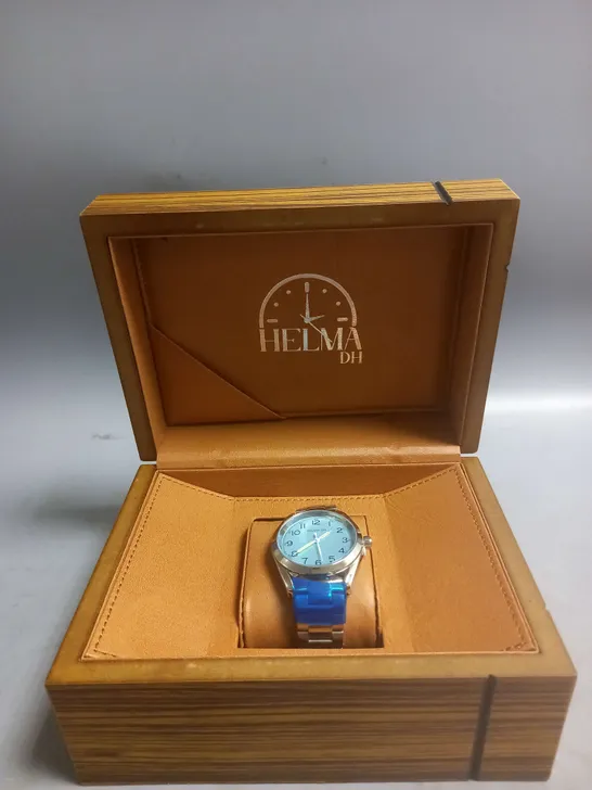 BOXED HELMA DH WATCH WITH PALE BLUE FACE IN SILVER