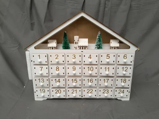 BOXED UNBRANDED PRE-LIT WOODEN VILLAGE SCENE ADVENT CALENDAR IN WHITE