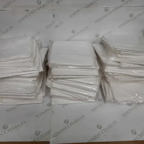 LOT OF APPROX 70 WHITE DISPOSABLE PAPER MEDICAL SHIRTS