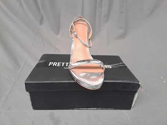 BOXED PAIR OF PRETTY LITTLE THING OPEN TOE HIGH HEEL SANDALS IN METALLIC SILVER UK SIZE 8