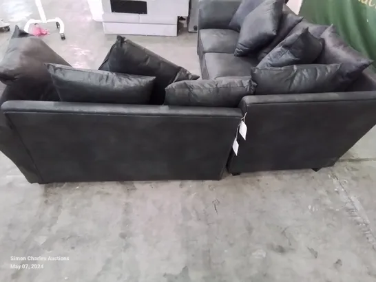 DESIGNER LEATHER LOOK FABRIC UPHOLSTERED CORNER SOFA IN BLACK HEAVILY DAMAGED AT REAR OF FRAME