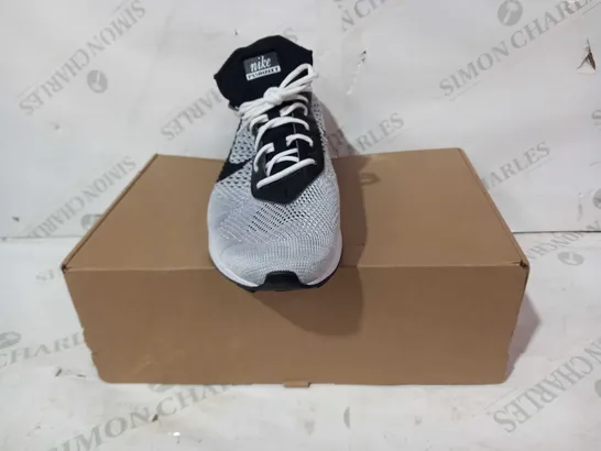 BOXED PAIR OF NIKE FLYKNIT SHOES IN WHITE/BLACK UK SIZE 7